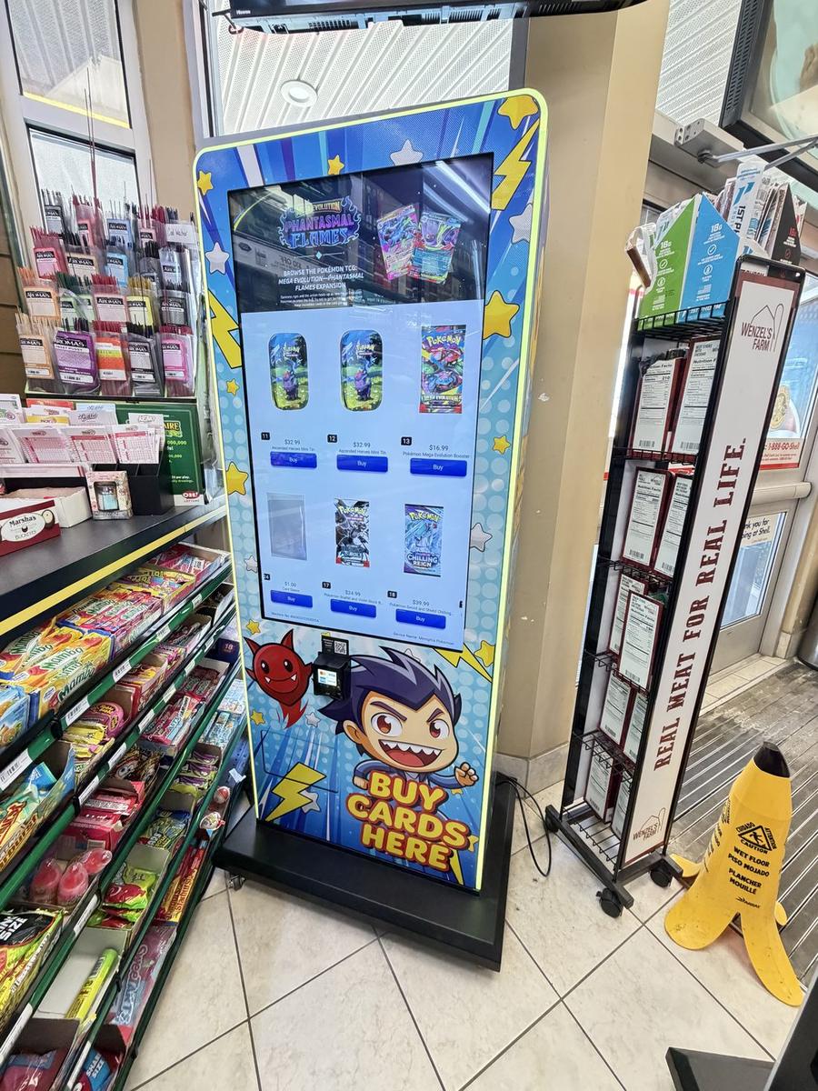An RC Vending trading-card machine installed inside a host location, with a bright touchscreen and card art wrap